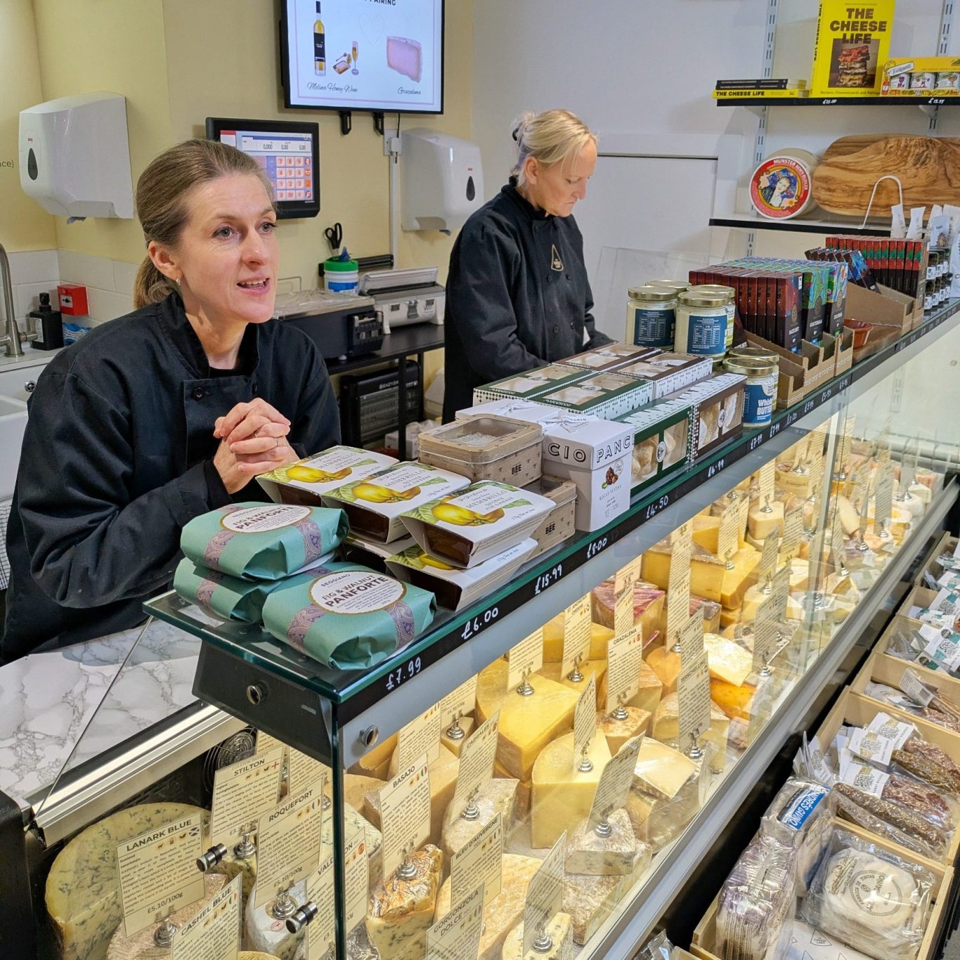 Svetlana Kukharchuk in conversation inside her cheese shop, The Cheese Lady, in North Berwick, Scotland.